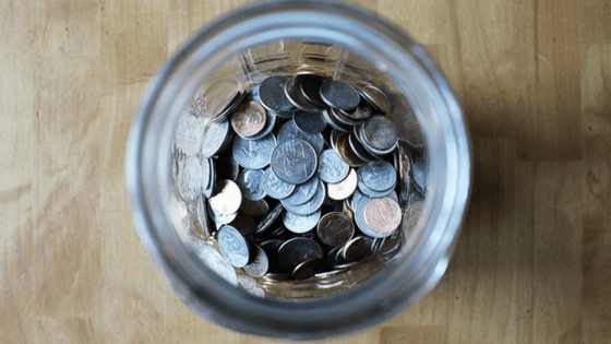 A jar of coins—Thinking about the money a tidy house can save you should help you get motivated to clean.