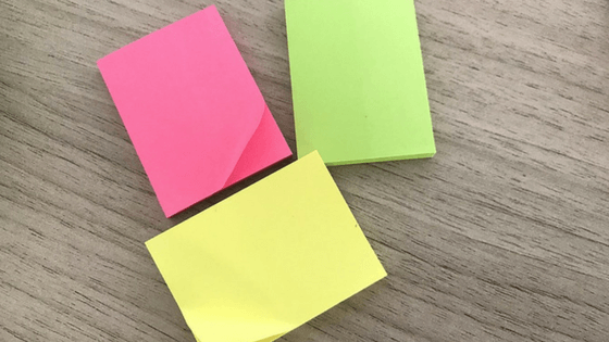 Pink, yellow and green Post It notes