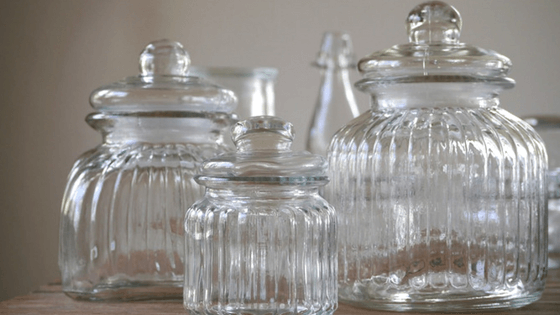 Use attractive containers for under-the-sink organization so you'll want to keep the space tidy.