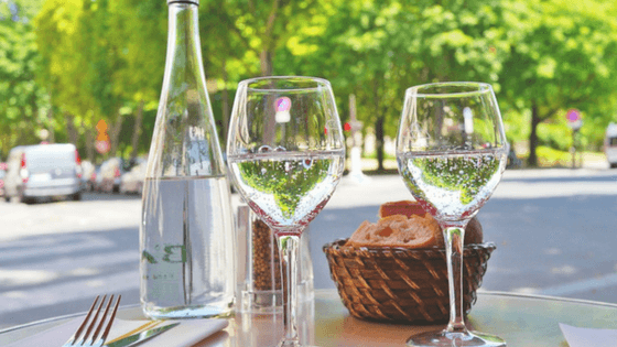 Skip sparkling or mineral water and drink tap water instead to save money at restaurants.