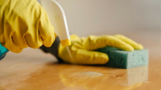 Wipe surfaces including the kitchen table and counters as part of your daily kitchen cleaning checklist.