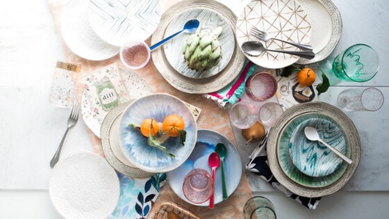 Pile of plates, glasses and cutlery