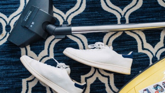 White sneakers and vacuum cleaner