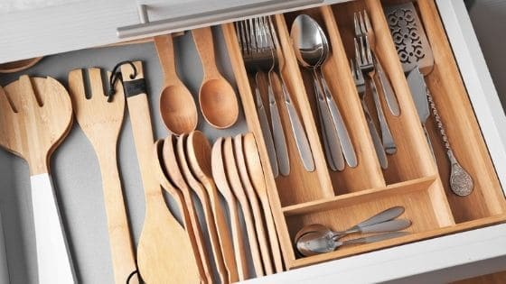 Organized kitchen drawer with cooking utensils and cutlery.